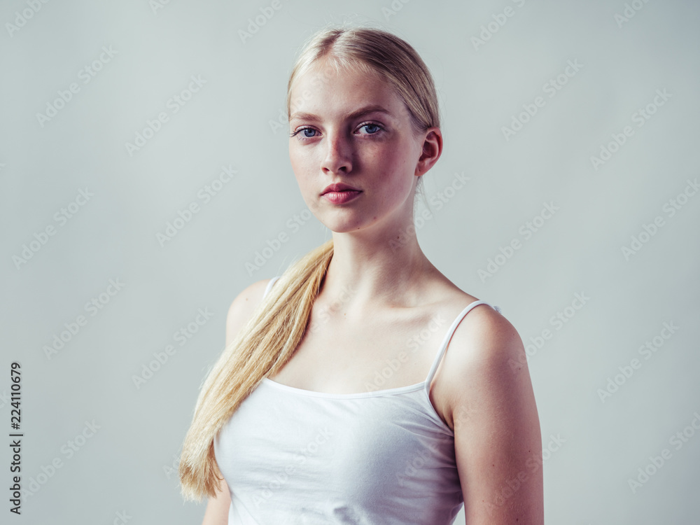 Blonde woman with long smooth hair natural portrait Blonde woman with long smooth hair natural portrait