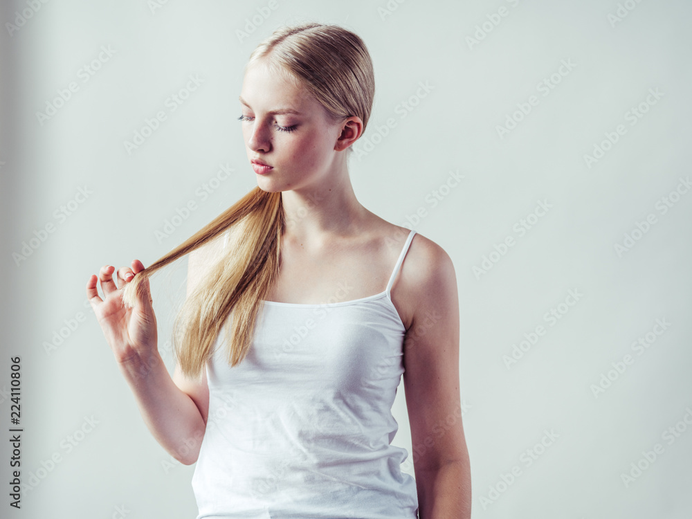 Beautiful blonde woman natural portrait with long blonde smooth hair Beautiful blonde woman natural portrait with long blonde smooth hair