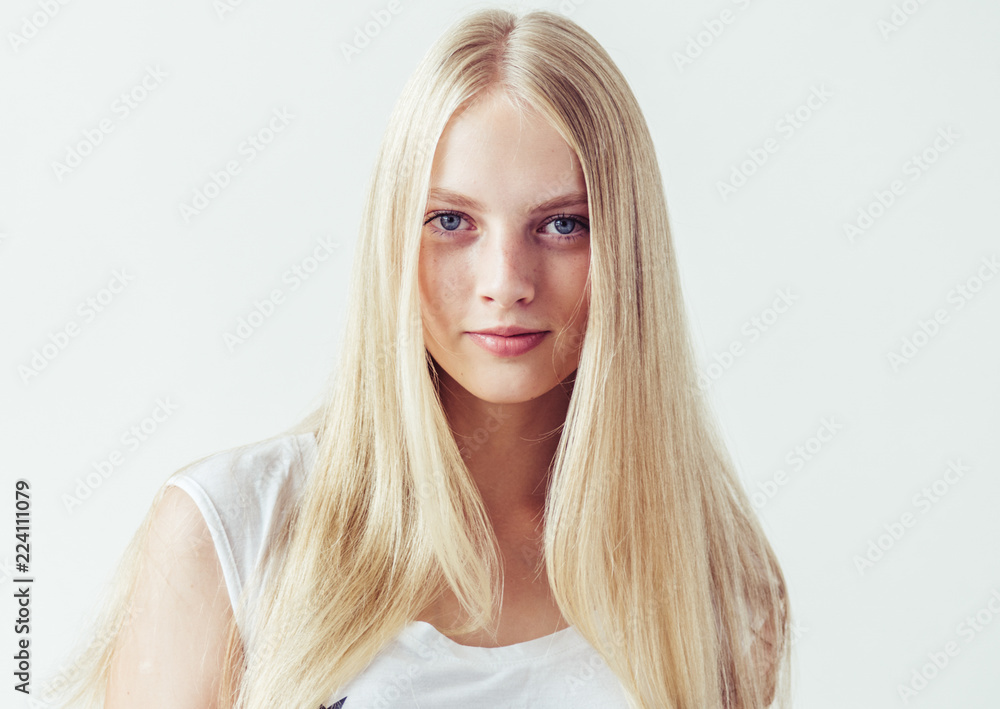 Beautiful blonde woman natural portrait with long blonde smooth hair Beautiful blonde woman natural portrait with long blonde smooth hair