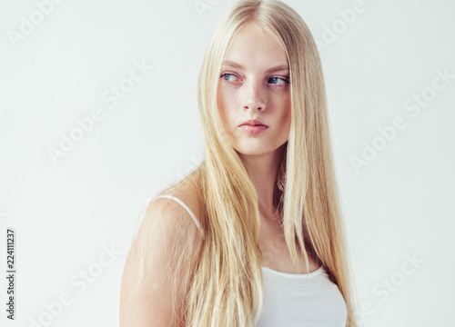 Beautiful blonde woman natural portrait with long blonde smooth hair