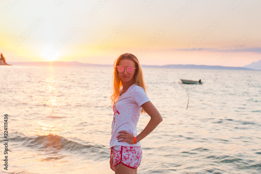 Attractive woman in front of the sea Attractive woman in front of the sea