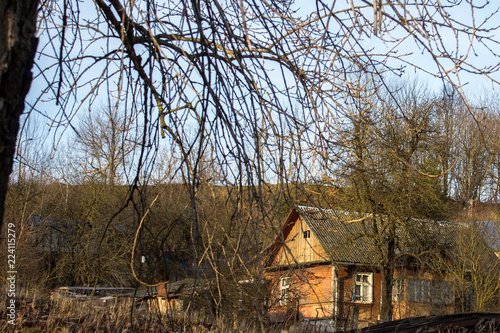 An old house in the spring rays of the sun as an echo of a past life. © Volha