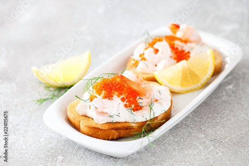 Toast skagen - shrimp and caviar on toast. Classic swedish appetizer. Selective focus. Copy space