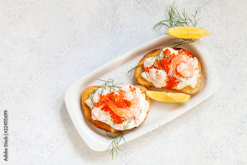 Toast skagen - shrimp and caviar on toast. Classic swedish appetizer. Top view. Copy space