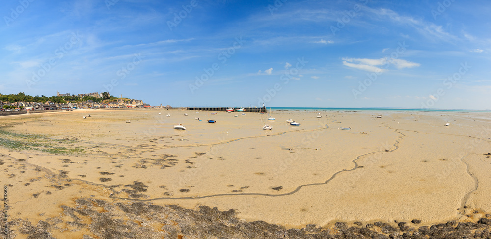 Beautiful cityscape view of the skyline and beach at low tide of the city Cancale, France, in summer