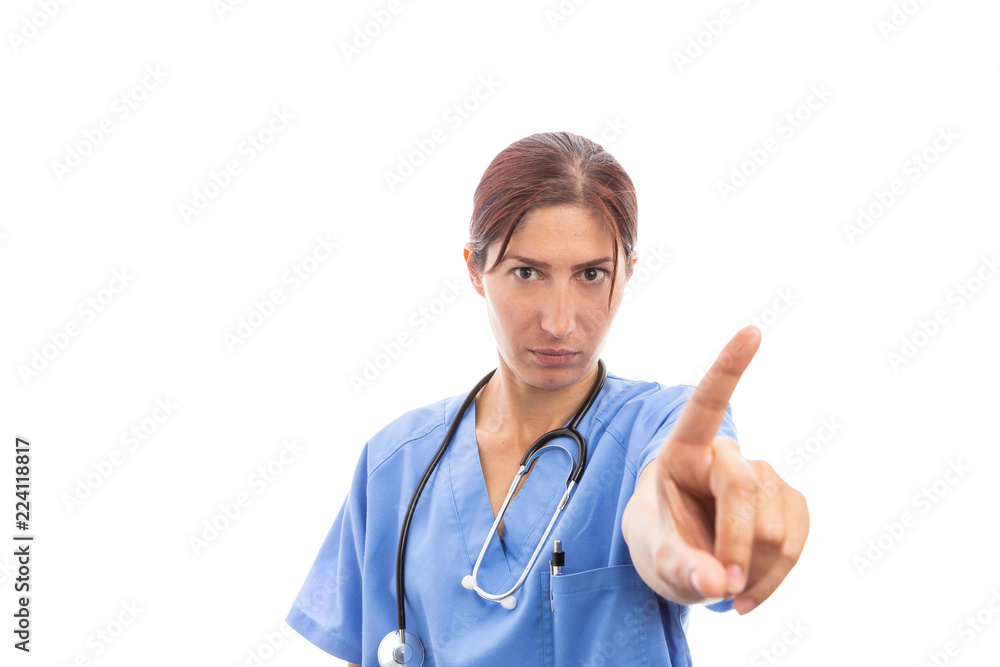 Serious woman nurse or doctor making dismissal finger gesture . Serious woman nurse or doctor making dismissal finger gesture .