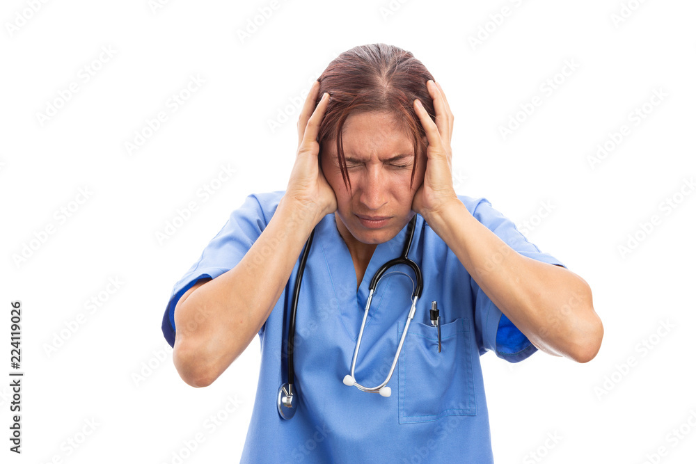 Stressed female hospital nurse grabbing head because of pain. Stressed female hospital nurse grabbing head because of pain.