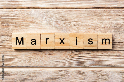 marxism word written on wood block. marxism text on table, concept photo
