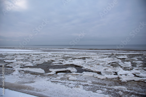 frozen lake shore in winter