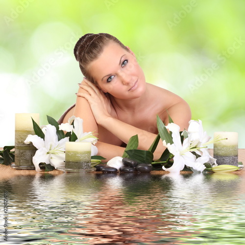 woman lying down relaxing on a massage bed at spa