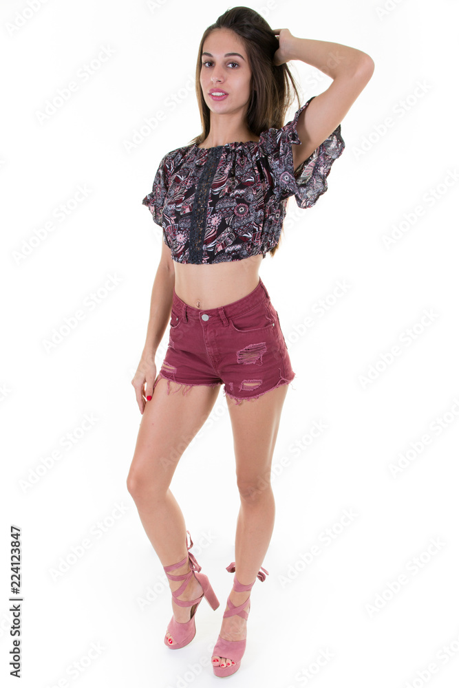 Young full lenght pretty woman hand on hairs isolated on white Young full lenght pretty woman hand on hairs isolated on white