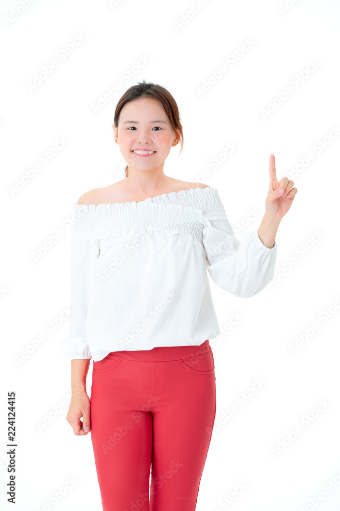 Asian woman beautiful smile in casual dress standing fingers point up portrait close up studio shot on the white backdrop. Asian woman beautiful smile in casual dress standing fingers point up portrait close up studio shot on the white backdrop.