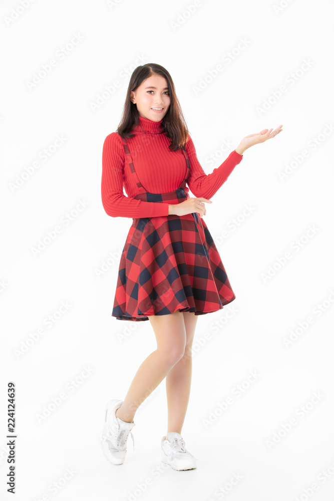 Beautiful Asain portrait woman in red casual dress standing and looking camera like holding something isolated on white background Beautiful Asain portrait woman in red casual dress standing and looking camera like holding something isolated on white background