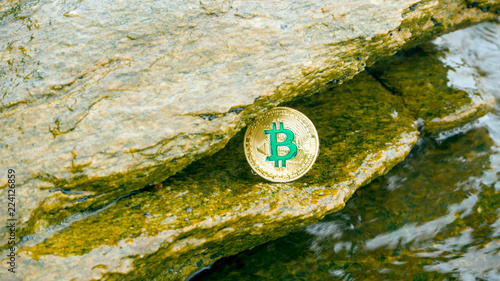 Crypto coin Bitcoin on the beach