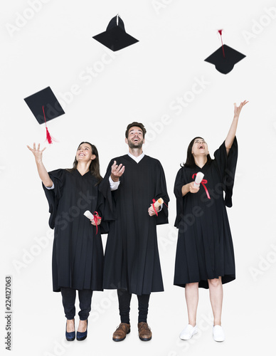 Group of grads throwing their hats in the air