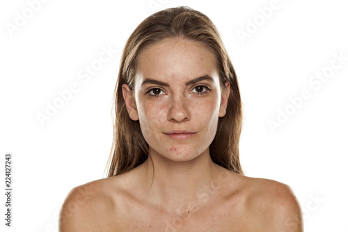 Portrait of young beautiful shirtless woman with no makeup on white backgeound