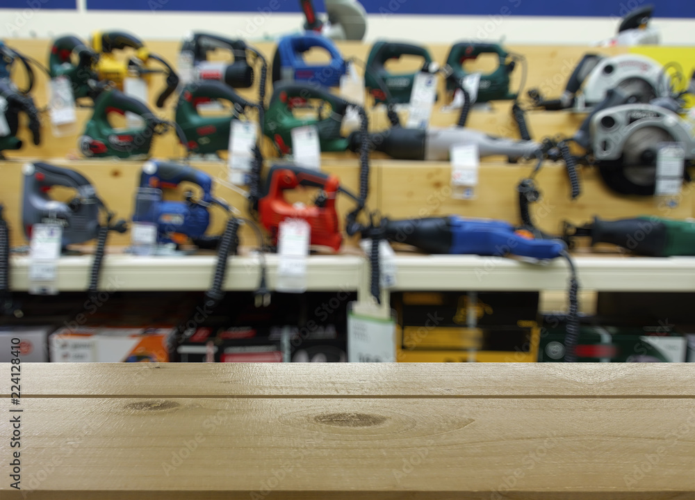 Obraz premium Shop for selling electric tools. Drills, screwdrivers, electric saws, grinder. Defocused, blurred image.