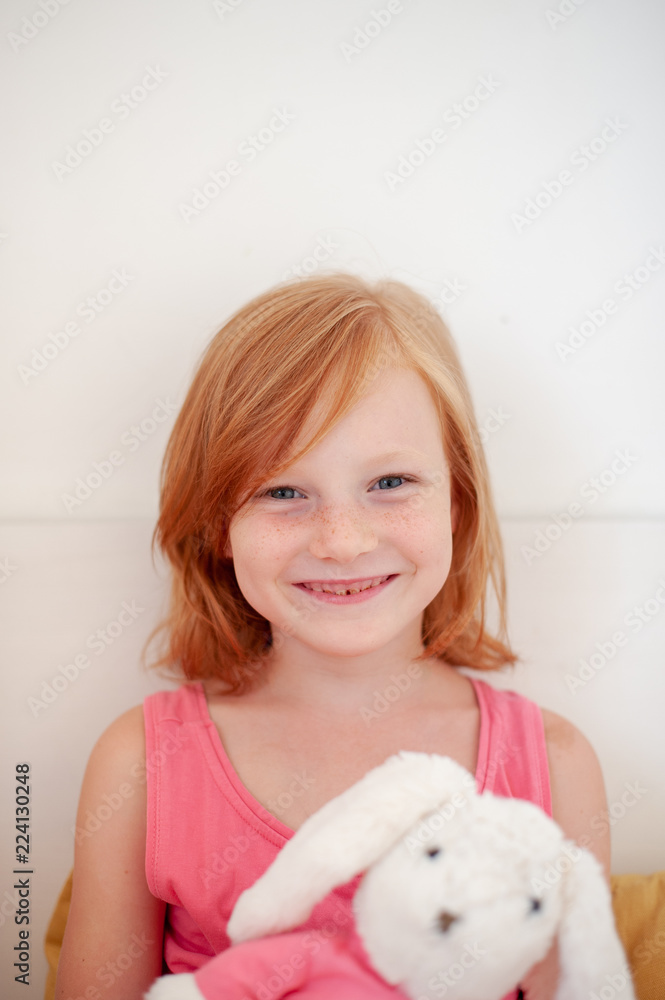 Smiling girl with plush rabbit Smiling girl with plush rabbit