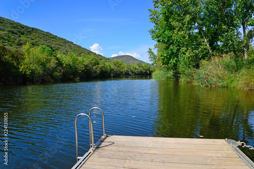 Floating platform in the Bullaque River of the natural setting of the Tables of the Yedra, Piedrabuena, Ciudad Real, Spain. photo