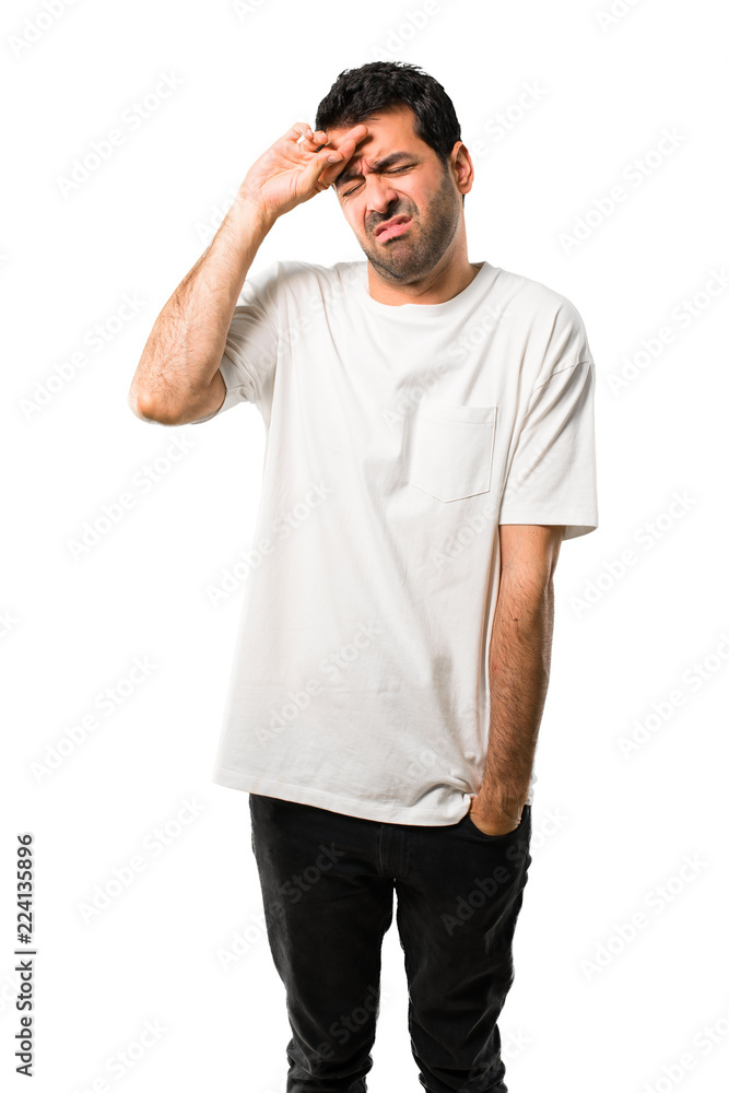 Young man with white shirt with tired and sick expression on isolated white background Young man with white shirt with tired and sick expression on isolated white background