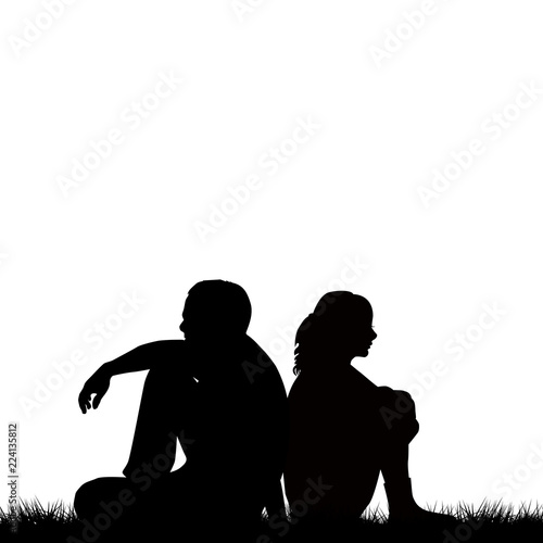 Silhouettes of sad couple sitting back to back