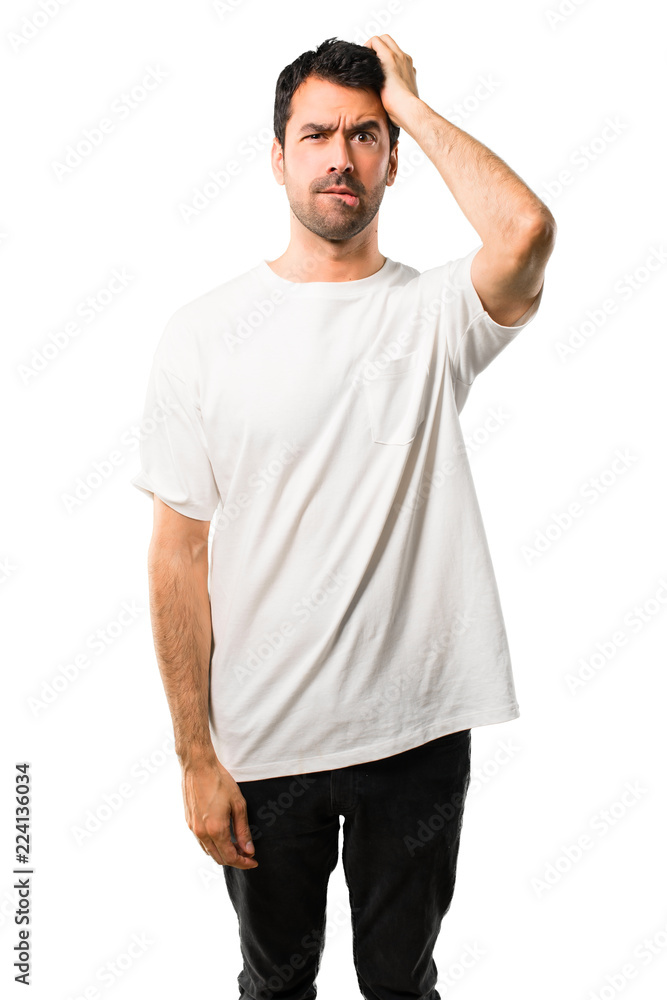 Young man with white shirt with an expression of frustration and not understanding. Confused gesturing on isolated white background Young man with white shirt with an expression of frustration and not understanding. Confused gesturing on isolated white background