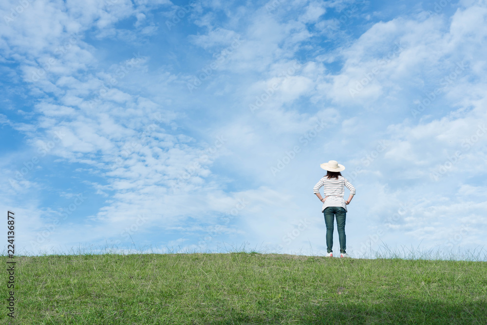 Woman standing on the mountain and looking beautiful sky. Woman standing on the mountain and looking beautiful sky.