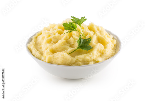 Mashed potatoes in bowl isolated on white.