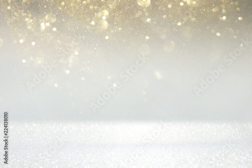 glitter vintage lights background. silver, gold and white. de-focused. © tomertu