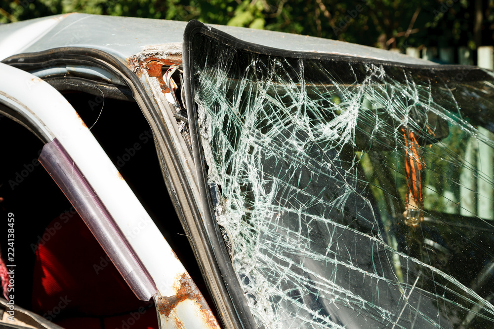 Car after accedent with broken windscreen. closeup