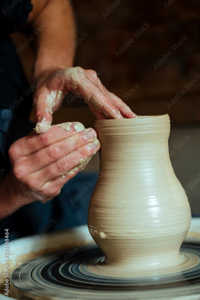 Creation of a vase and modeling of clay in a professional pottery workshop Creation of a vase and modeling of clay in a professional pottery workshop