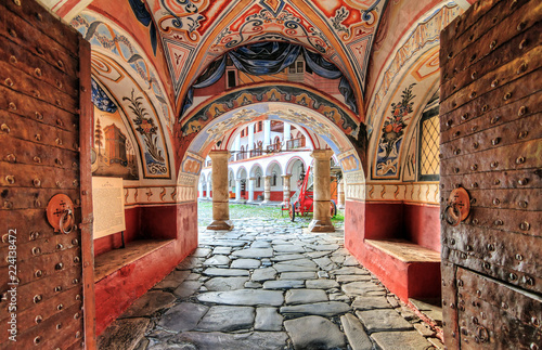 Beautiful view of the entrance gate at the Orthodox Rila Monastery, a famous tourist attraction and cultural heritage monument in the Rila Nature Park mountains in Bulgaria photo