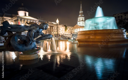 Fountain in Trafalgar Square at night, London, UK