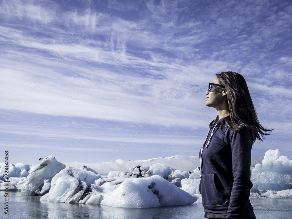 Woman enjoying the view in Jokulsarlon Glacier Lagoon in Iceland