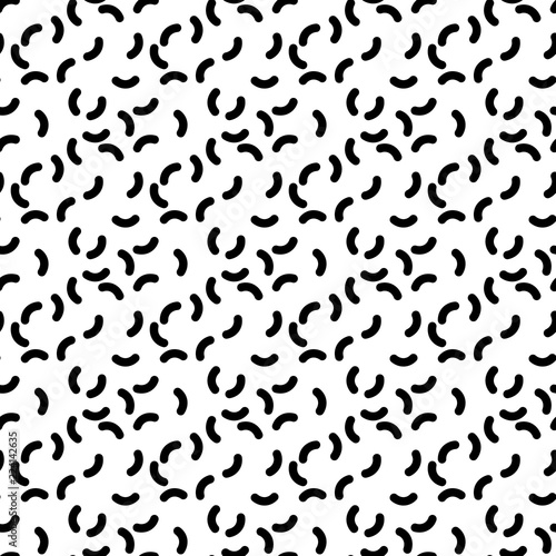 Seamless pattern of short curves. Black worms on white background. Abstract vector pattern.