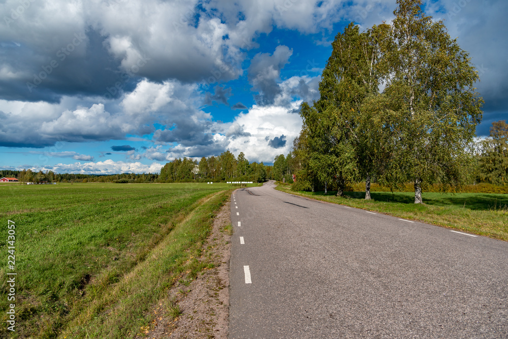 a road and a cloudy sky in storfors sweden