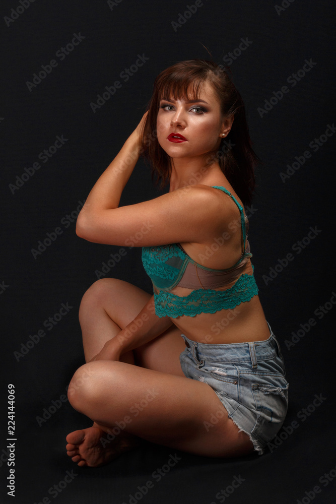 portrait of a young girl in sexy lingerie and shorts portrait of a young girl in sexy lingerie and shorts