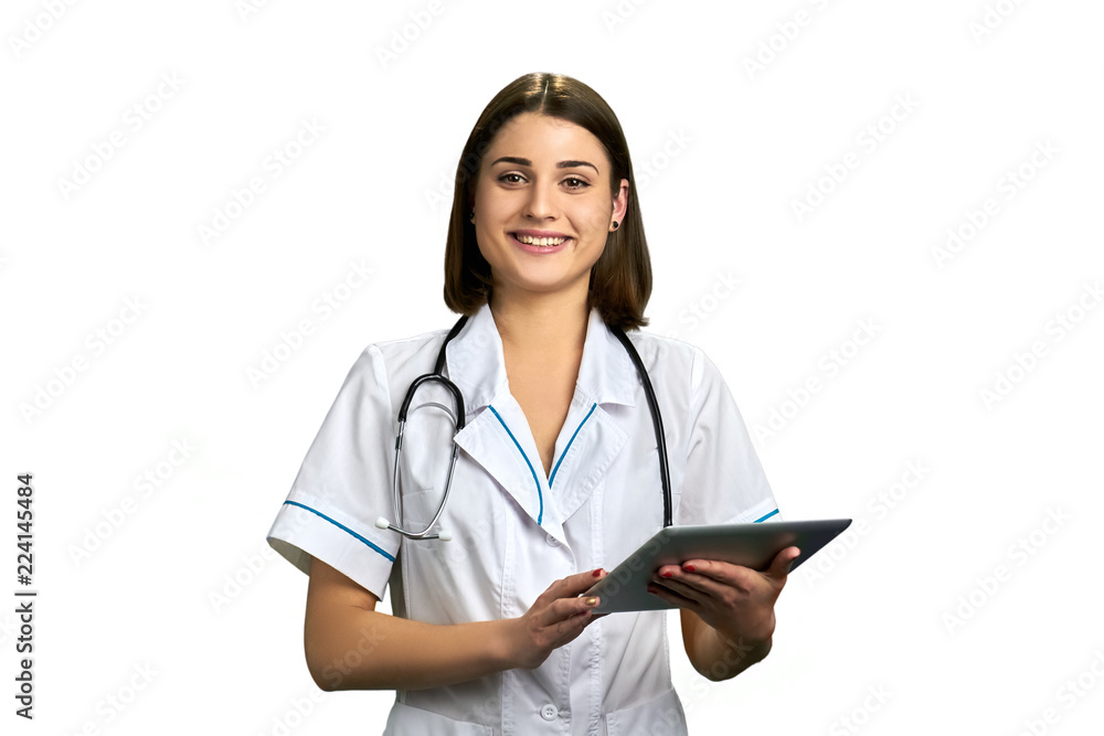 Young cheerful doctor with pc tablet. Happy smiling physician isolated on white background. People, medicine, equipment and profession. Young cheerful doctor with pc tablet. Happy smiling physician isolated on white background. People, medicine, equipment and profession.