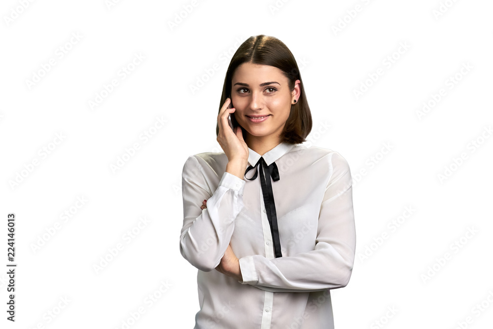 Cute girl talking on mobile phone. Portrait of beautiful lady in modern blouse talks on cell phone and smiling, isolated on white background. Cute girl talking on mobile phone. Portrait of beautiful lady in modern blouse talks on cell phone and smiling, isolated on white background.