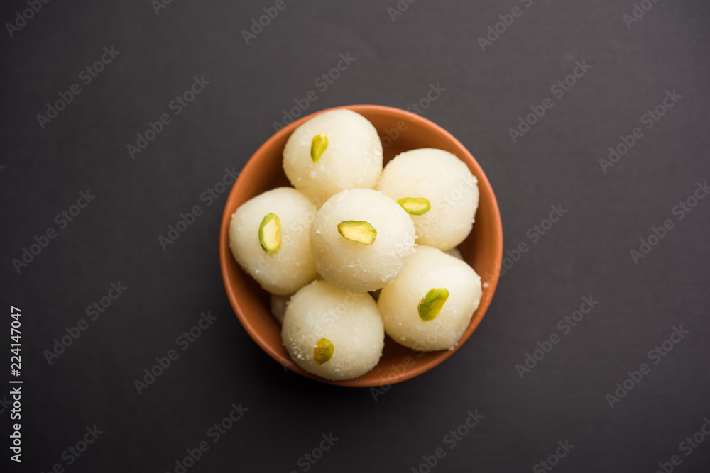 Indian Rasgulla or dry Rosogulla dessert/sweet served in a bowl. selective focus