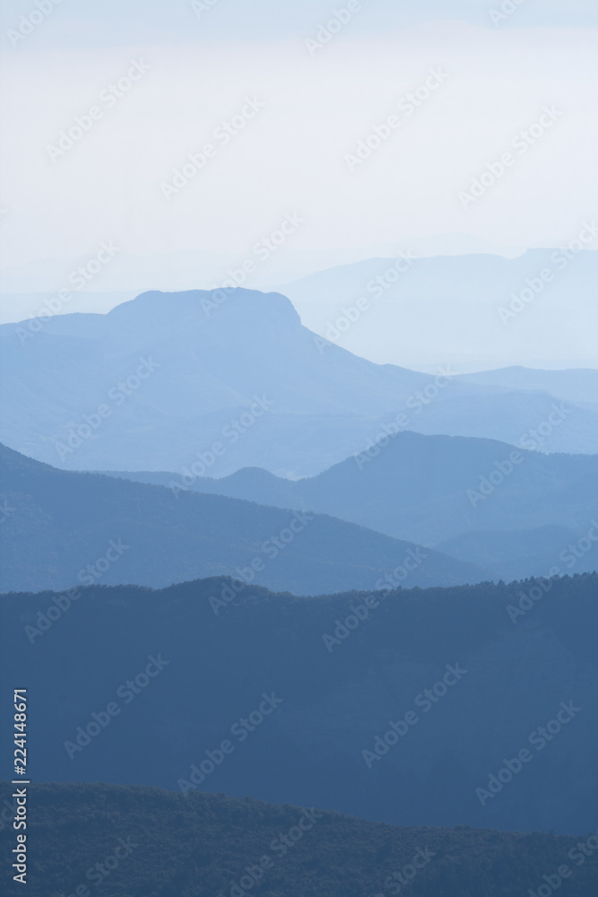 Blue layers of mountain ridges in the french alps
