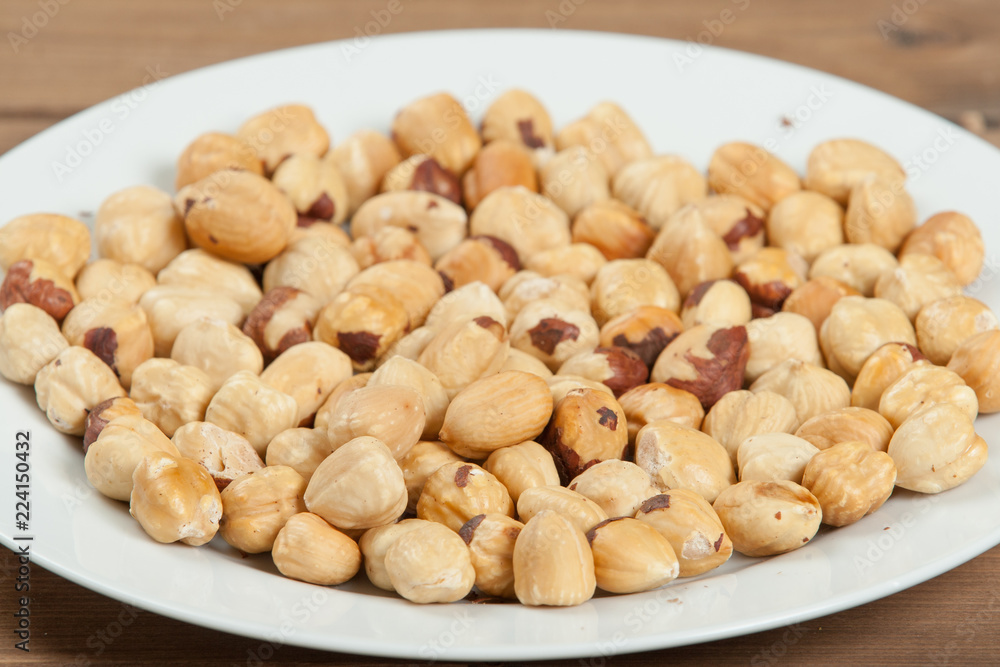 Peeled Baked Hazelnut Nuts On Plate.