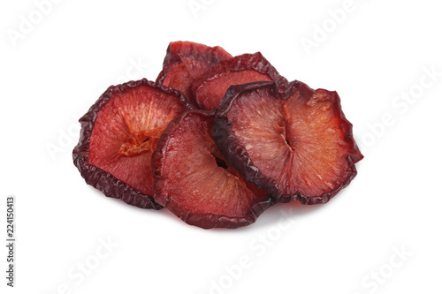 Sliced dried red plum on white