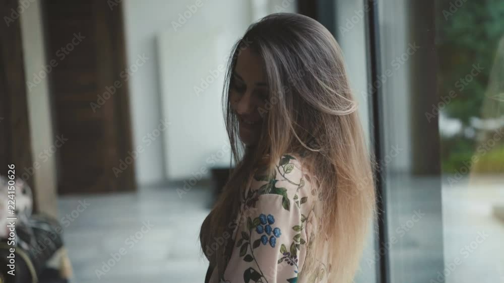 Pretty girl looks at window and camera with smile Pretty girl looks at window and camera with smile