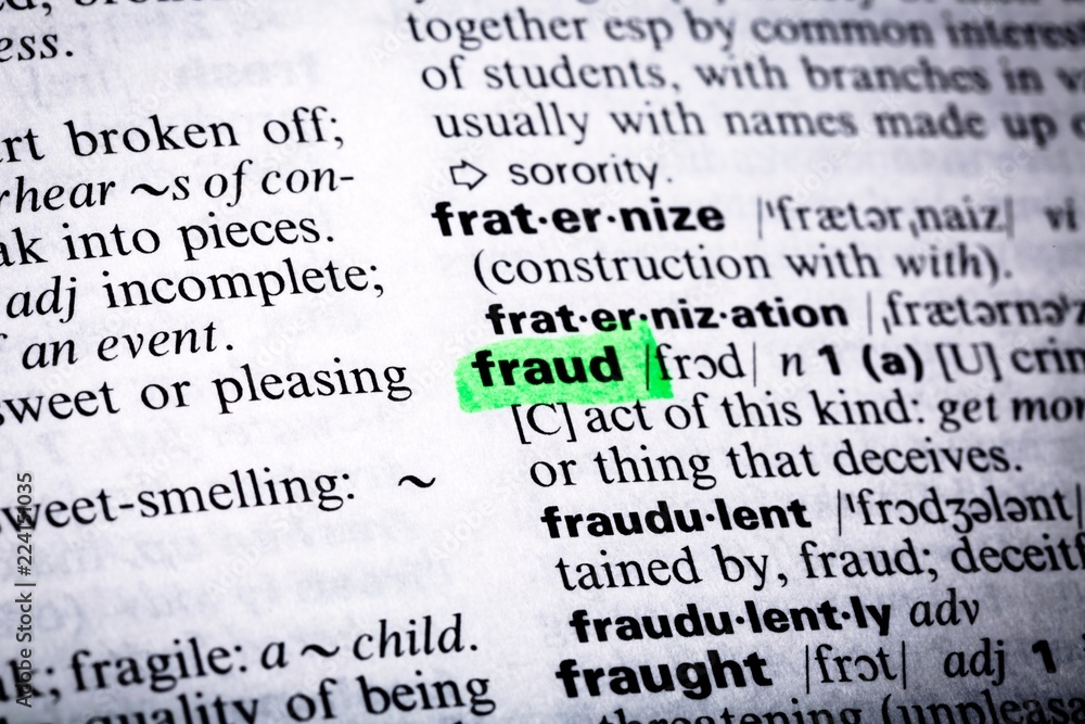 Close Up of Highlighting Specific Word Fraud in a Dictionary
