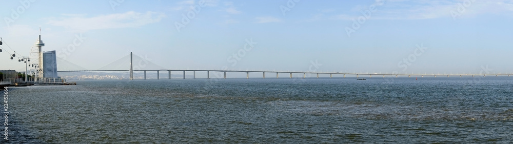 The panoramic view of Vasco da Gama bridge and river Tagus promenade. Lisbon. Portugal
