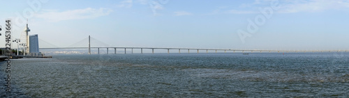 The panoramic view of Vasco da Gama bridge and river Tagus promenade. Lisbon. Portugal