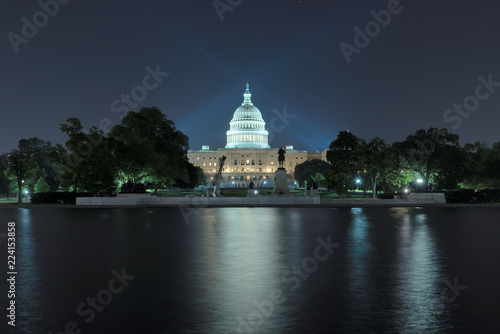Washington DC. The United States Capitol building with the dome lit up at night. 