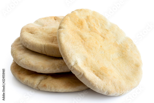 A stack of pita breads isolated on white from above.
