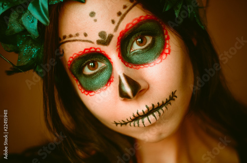 Fototapeta Naklejka Na Ścianę i Meble -  Young caucasian woman in catrina calavera style makeup horizontal portrait close up face